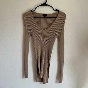 Stretchy, soft, and very flattering ribbed top with side slits